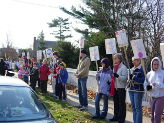 Demonstrators carrying signs